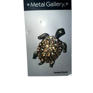 Gallery Elegant Gold and Black Brooch